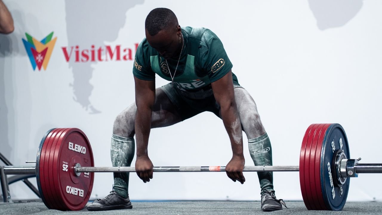Strength Calculator 1-Rep Max estimation chart and workout tracking interface
